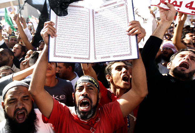 A protester holds a Quran at a Salafi rally for the enforcement of Islamic Shariah law last fall in Cairo's Tahrir Square. Repressed during the rule of President Hosni Mubarak, the country's ultra-conservative Salafis have seen a resurgence since the Arab Spring uprising.Mohamed Abd El Ghany/Reuters/Landov