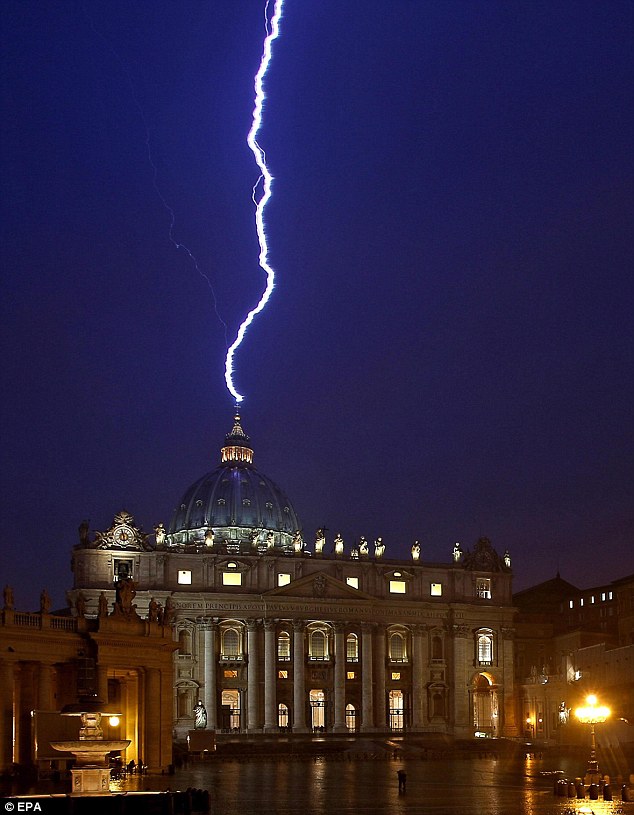 Lighting strikes the basilica of St.Peter's dome earlier this evening during a storm that struck Rome on the same day Pope Benedict XVI announced his resignation