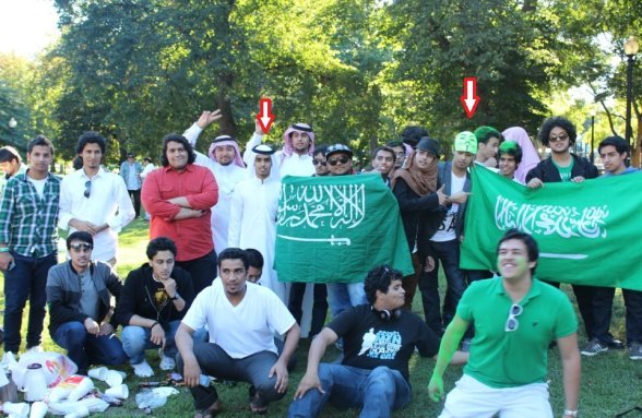 Here’s Ali- Alharbi at a picnic with a buddy in an Anonymous mask. via The Jester