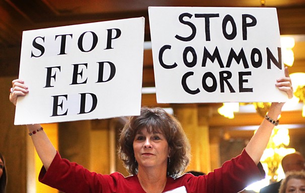 Frank Espich/AP - In this Jan. 16, 2013, photo, concerned grandparent Sue Lile of Carmel, Ind., shows her opposition to Common Core standards during a rally at the State House rotunda in Indianapolis.