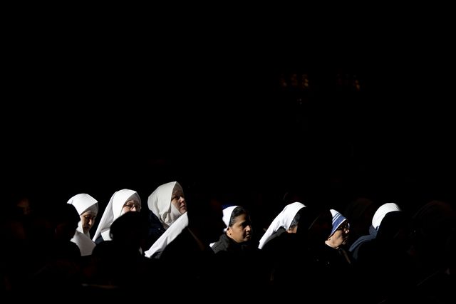 Nuns attend a mass celebrated by Pope Francis in St. Peter's Basilica, at the Vatican, to mark Epiphany, Monday, Jan. 6, 2014. The Epiphany day, is a joyous day for Catholics in which they recall the journey of the Three Kings, or Magi, to pay homage to Baby Jesus. (AP Photo/Andrew Medichini) 