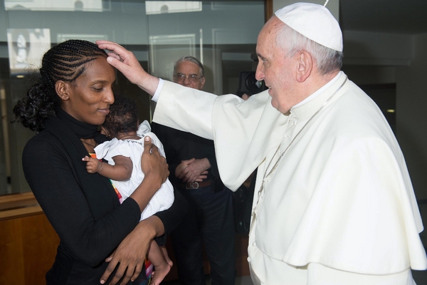 Pope Francis meets Meriam Ibrahim, from Sudan, with her daughter Maya in her arms, at the Pope's Santa Marta residence, in the Vatican, July 24 2014. (Reuters/Osservatore Romano/Handout/EPA/Landov) 